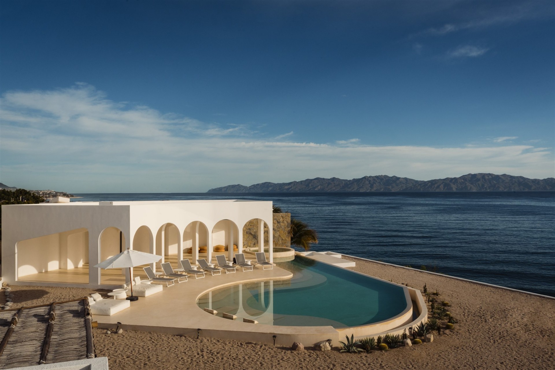 Arches and infinity pool over the sea