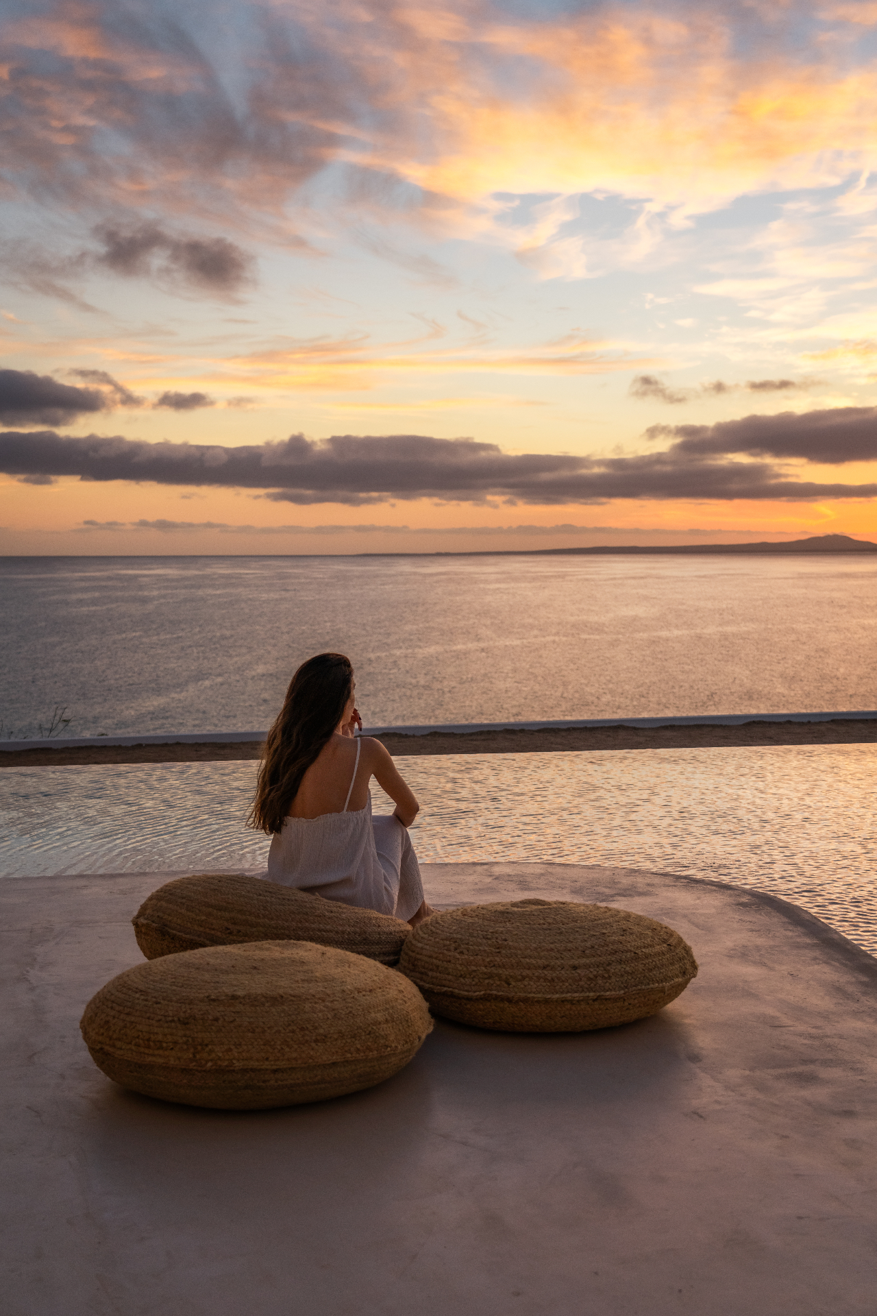 A quiet moment by the infinity pool at sunset